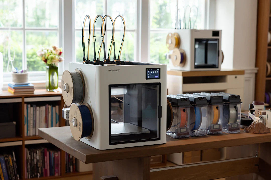 Modern 3D printer with multiple filament spools in a well-lit home studio
